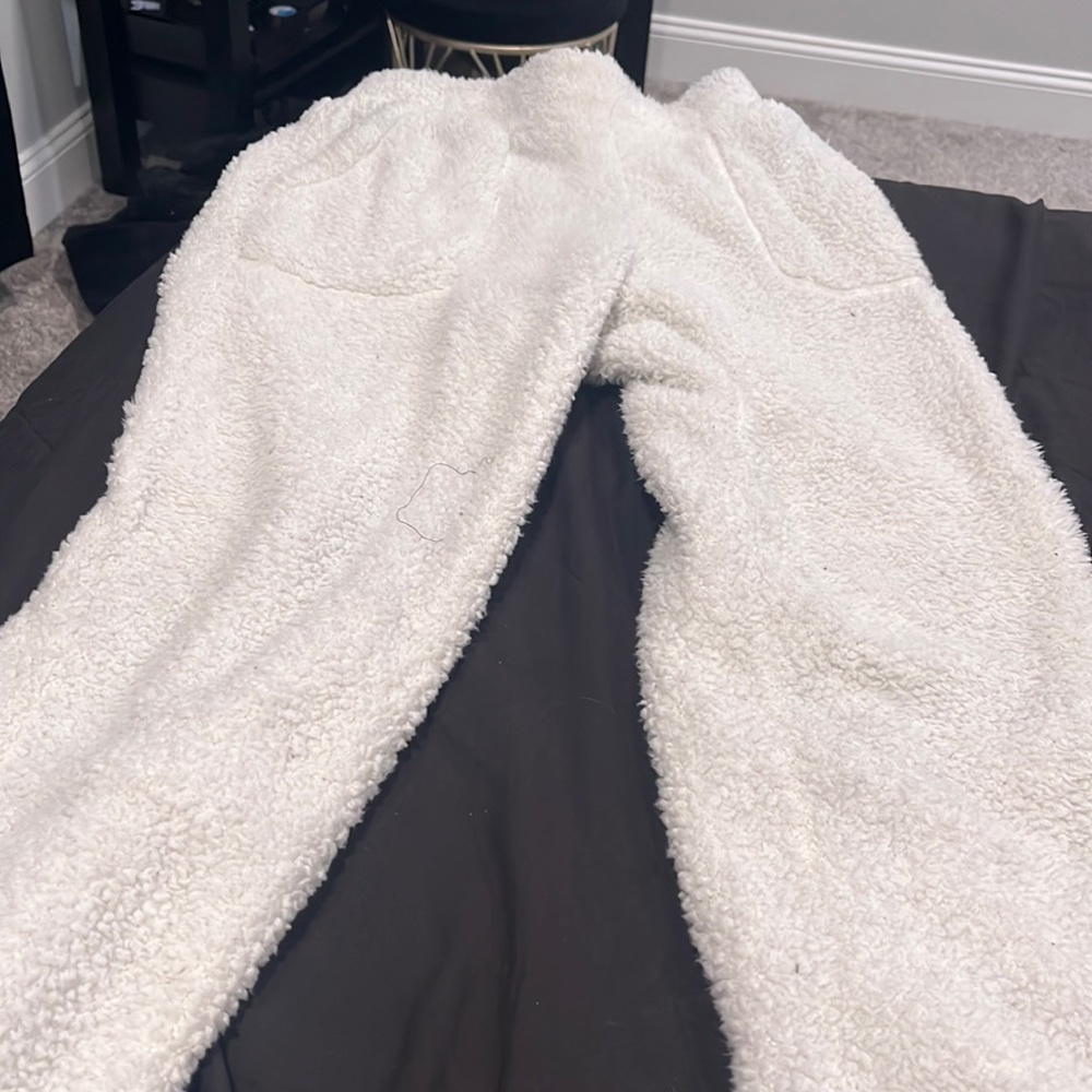 white fluffy baggy sweats with heart on pocket
